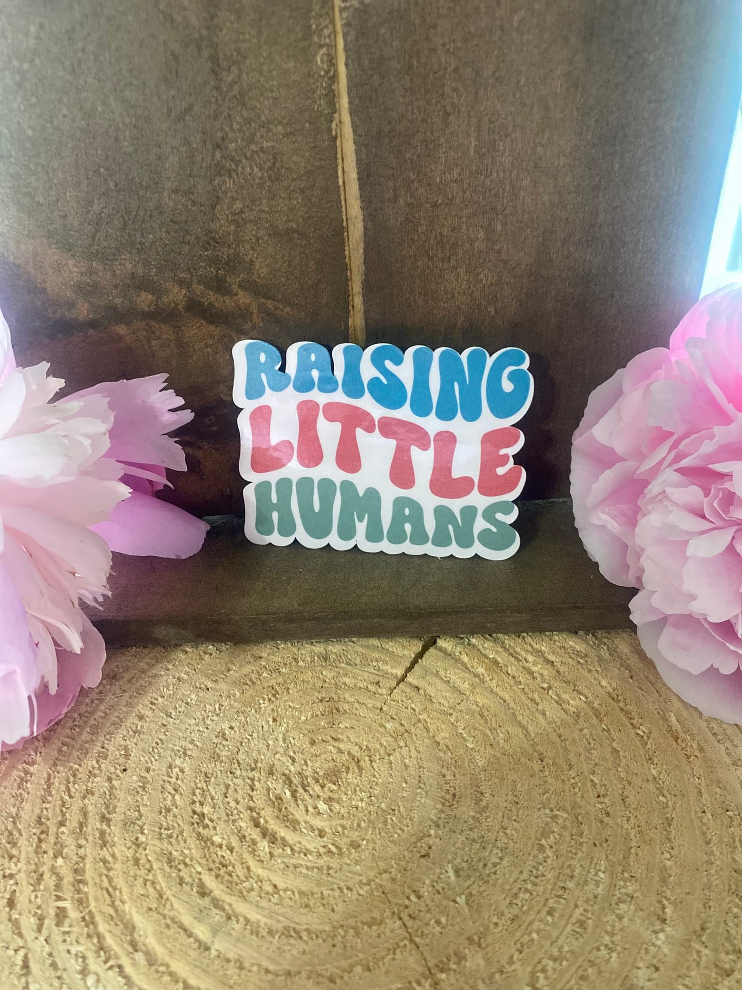 Raising little humans Sticker