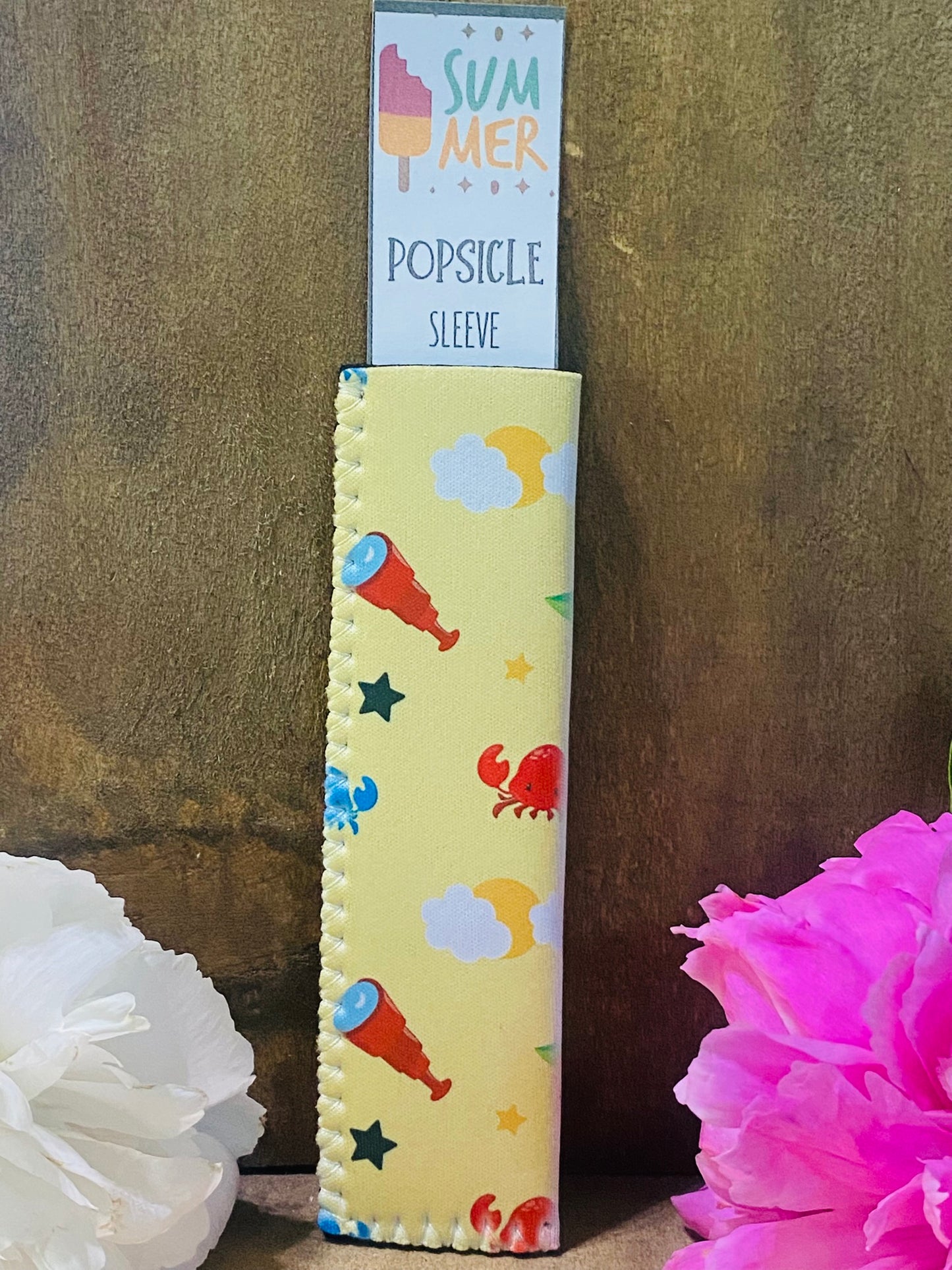 Freeze Pop Sleeve Telescope and crab on yellow